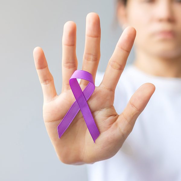 Metrolina-Neurological-Associates-hand-with-purple-ribbon-for-epilepsy